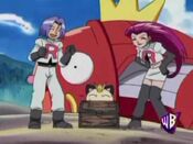 Team Rocket tries to open the chest