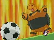 Torkoal stands up to kick the ball