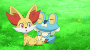 Froakie cleans Fennekin's tail