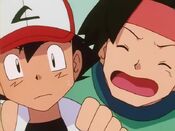 Tracey yells to Ash they need to visit Oak