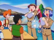 Jessie and James shower Meowth with water