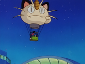 Team Rocket's balloon hovers over the building