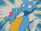 Totodile gnaws on Kingdra's mouth