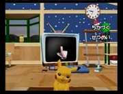 The indigo Nintendo GameCube near the player's TV in the E3 2003 build of Pokémon Channel