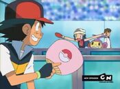 Ash holds a fan