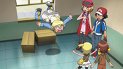 The heroes and Emilio having entered the Pokémon Center through a window