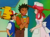 Brock takes the guide book to impress Nurse Joy