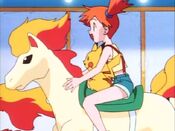 Misty and Pikachu on a carousel