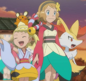 Serena, while wearing a design dress is walking on stage with Bonnie and Braixen