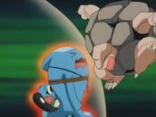 Totodile hides behind Wobbuffet, who uses Counter against Golem