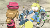 Clemont prepares a machine to measure Mega Lucario's power