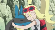Korrina hugs Lucario, who was rescued from Team Rocket.
