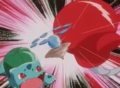 Hitmontop saves Bulbasaur from Team Rocket's jet punch and rebounds the attack at them.