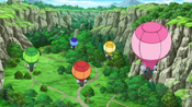 The trainers flying behind their Pokémon