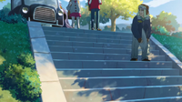 Victor and Gloria, standing at the top of the steps, in Twilight Wings (anime)