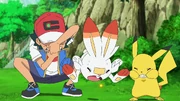 Ash and Pikachu helping Goh's Scorbunny learn a move.