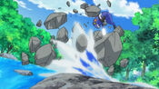 Brock's Croagunk smashes the boulder with Brick Break