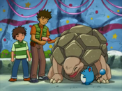 Brock dries Golem with a fan