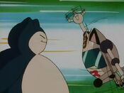 Snorlax evades Meowth's attacks