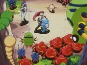 Team Rocket are surrounded by Pokémon