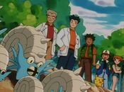 The heroes watch the fossil Pokémon going back