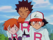 Misty cosplaying in Team Rocket's white uniforms with Ash and Brock