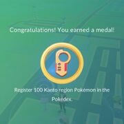 Earning a gold medal for registering 100 Kanto region Pokémon