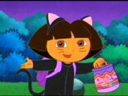 Dora dressed as a cat for Halloween.