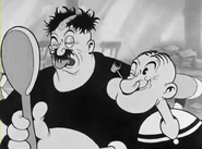 ...to Bluto's messy shaven.