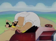 Olive resists Bluto's amorous advances