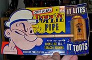 A Popeye toy pipe that lights up and toots