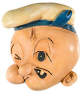 A rare Poopeye figural string holder toy released in 1953