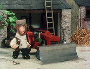 The Red Tractor with Bulldozer Blade attached.