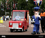 Pat with Jess and PAT 1 walking along the road to Buckingham Palace