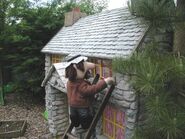 Alf painting the windows on the original version