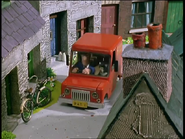 Pat driving his van in the village