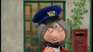 Mrs. Goggins with a postman's hat
