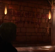 A petrified Mrs Norris hanging by a message announcing that  had been opened.