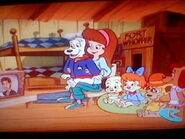 One Happy Family.jpg (60 KB) Cooler, Holly and the other Pound Puppies watching tv.
