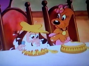 Buster chows down as Nose Marie glares at him.