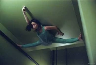 River Tam (Firefly/Serenity) clings to the ceiling.