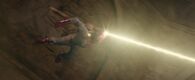 Vision (Marvel Cinematic Universe) firing an energy beam from the Mind Stone in his forehead.