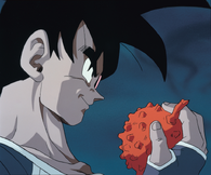 Turles (Dragon Ball Z: The Tree of Might) holding a Fruit of the Tree of Might, which was spawned by the Tree of Might when it absorbed an entire planet's natural energy, granting its eater massive increase in power.