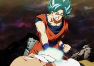 Goku (Dragon Ball series) channeling his godly Ki in an attempt to restart Master Roshi's heart.