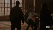 The Nogitsune/Void Stiles (Teen Wolf) using its Fox-like superhuman strength to overpower a werewolf.