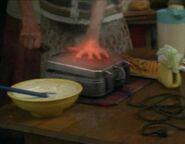 Mrs. Comey (Heroes) uses her power to heat waffles.