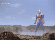 Ultraman Cosmos Eclipse Mode (Ultraman) firing Cosmium Beam.