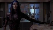 Illyria (Angel) manifesting a leather bodysuit.