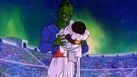 Pikkon (Dragon Ball) removing his weighted cape and hat, which serve as limiters.