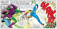 Norman Osborn/Green Goblin (Marvel Comics) fires an energy beam from his hands.